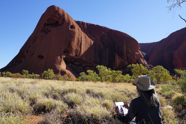 Budhiana painting on location at Kata Juta. Image Made Budhiana