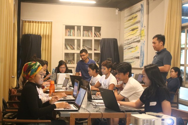 volunteers, futuwonder members and wiki pedia indonesia at work on laptops during the edit-athon