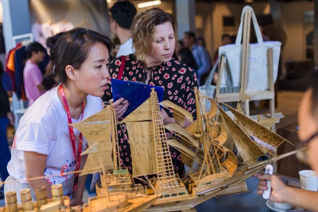 Ella Ritchie (Director &amp; Co-Founder, Intoart UK), accompanied by Samantha Tio (Director &amp; Co-Founder, Ketemu Project), while judging at "Pasar Ketemu" Image courtesy of KETEMU PROJECT