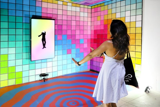 An audience member at Art Bali interacts with Agung 'Agugn' Prabowo's installation " " Image coutesy of Art Bali